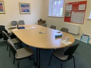 Board Room-Large Boardroom c/w 10 Grey Cloth Chairs, 4 x Green Leather Chairs, 3 x Framed Pictures, - 1 x Small Table,1 x Coat Stand, 1 x Leather Puffee 1 x Thor Undercounter Fridge, 1 x Silver Toaster, - 1 x Coffee Maker, 1 x Clock